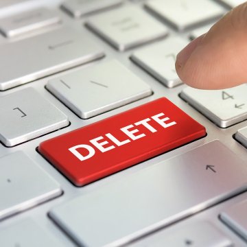 finger pressing red delete key on keyboard system optimizers advanced system repair